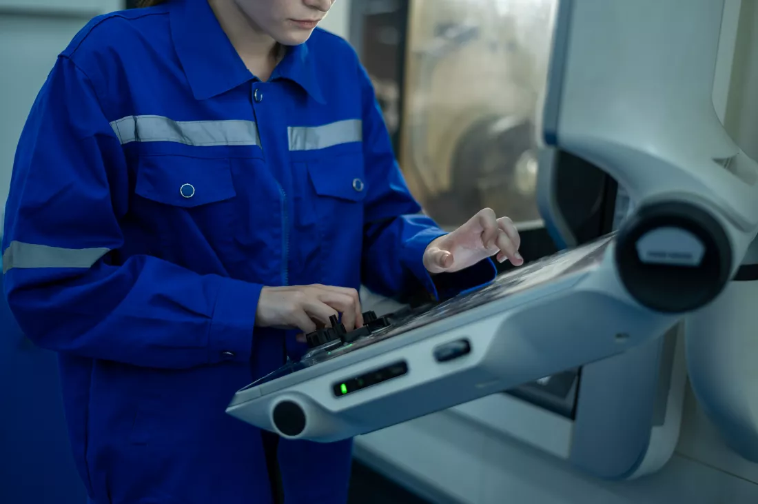 female-robotics-engineers-using-controller-remotely-operate-programming
