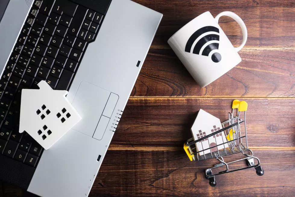high-angle-view-laptop-shopping-cart-table