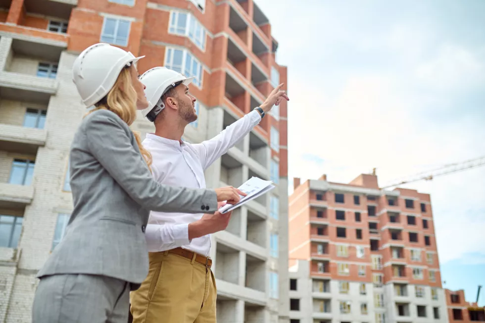 woman-with-drawing-man-pointing-hand-up