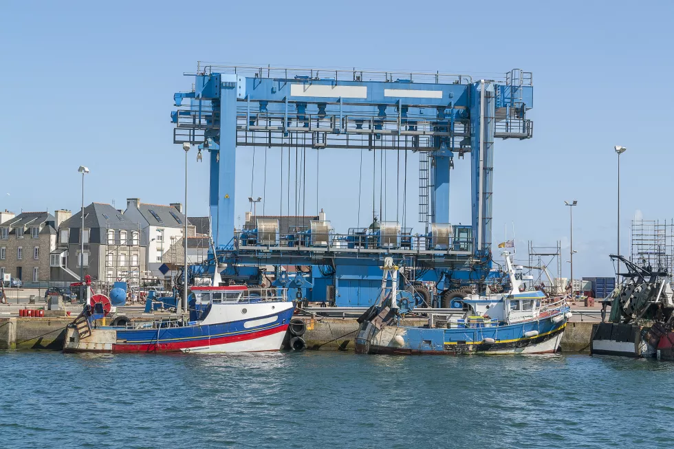 ship-moored-harbor-against-clear-blue-sky