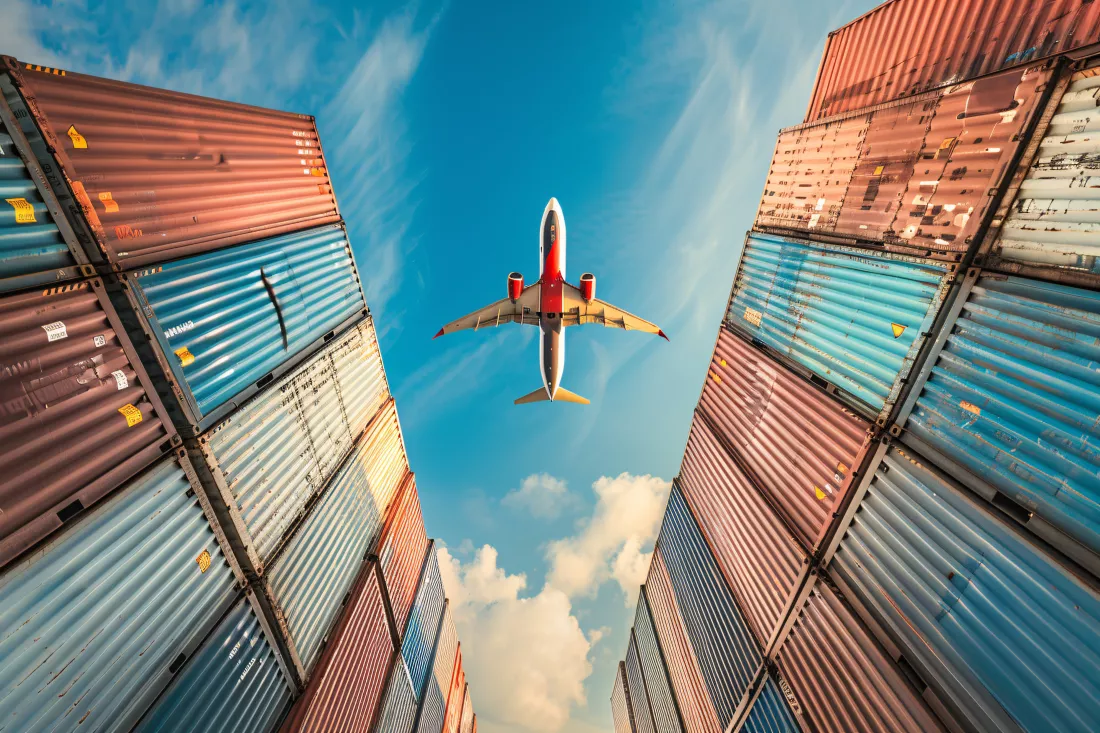 airplane-flying-shipping-containers