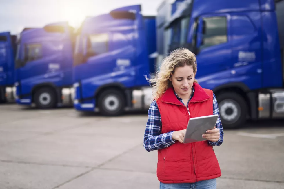 truck-driver-holding-tablet-checking-route-new-destination