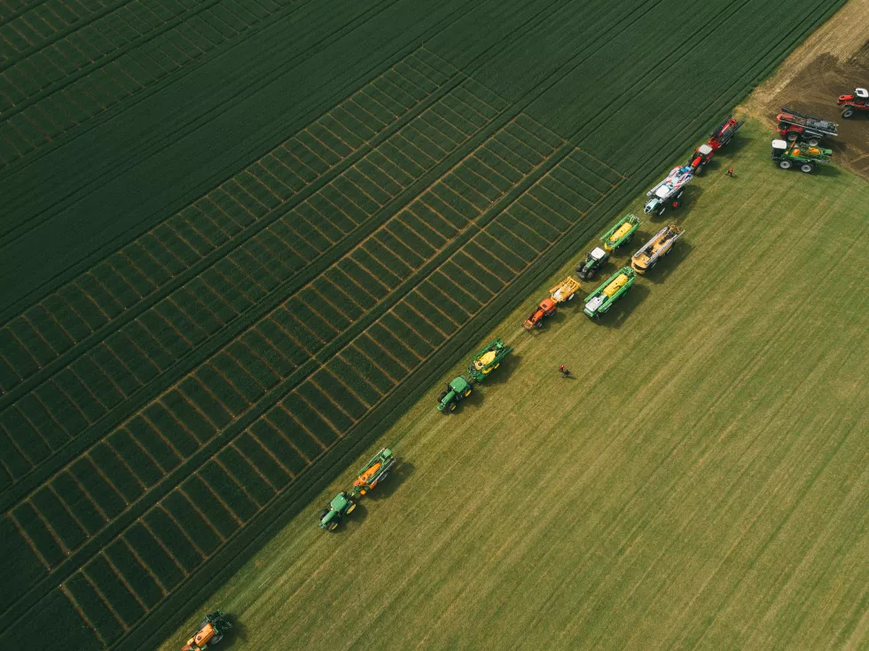 aerial-view-machinery-working-agricultural-field