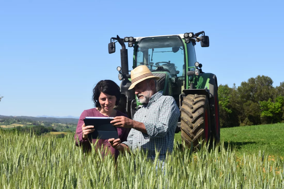 couple-farmers-field-with-digital-tablet