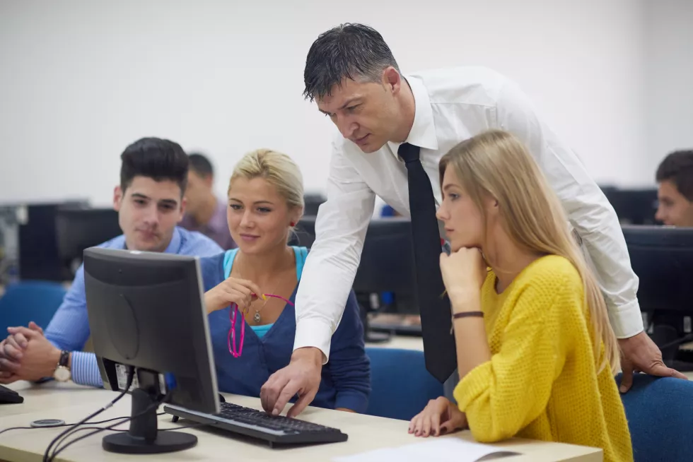 group-students-with-teacher-computer-lab-classrom-learrning-lessons-get-help-support