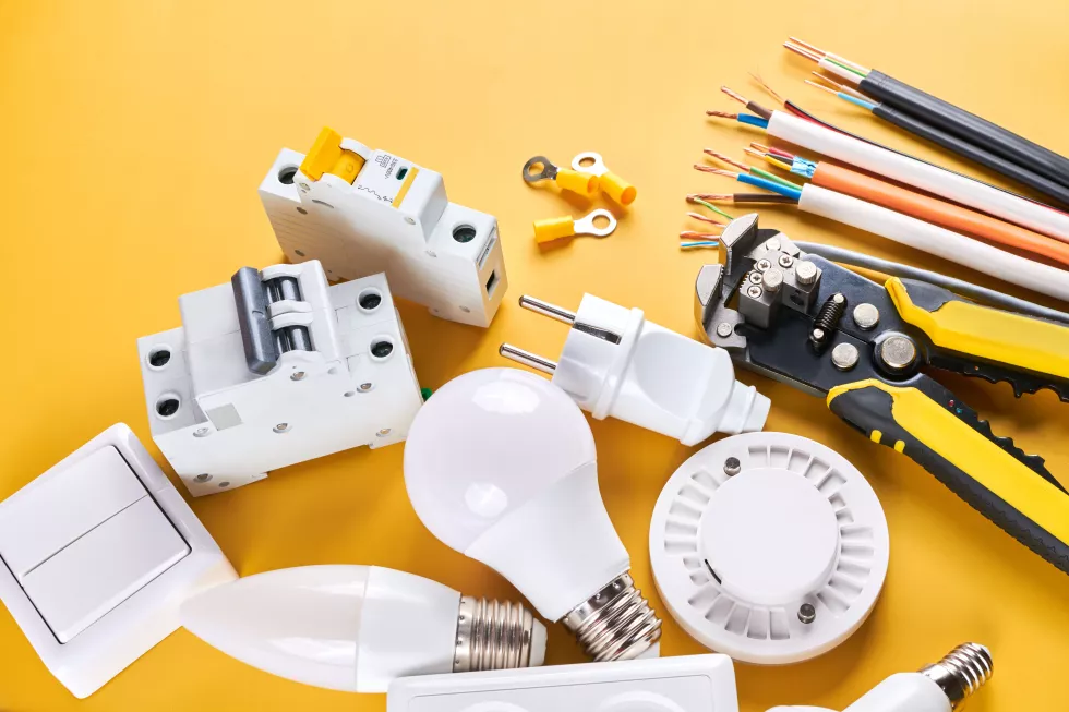 electrical-tools-set-with-dimmer-switch-isolated-yellow-background-with-copy-space-controllable-lighting-saving-energy-concept-building-renovation