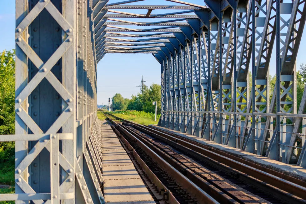 view-through-railway-bridge-countryside-sunny-morning