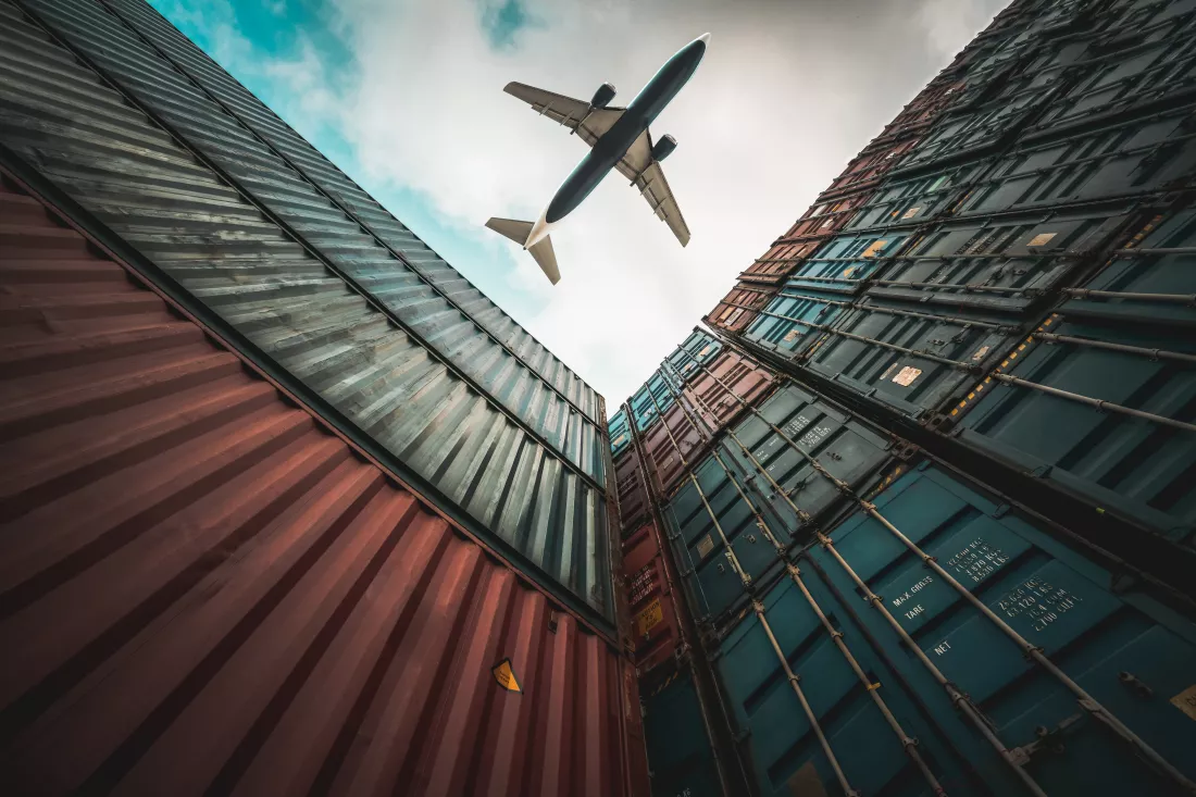 freight-airplane-flying-overseas-shipping-container