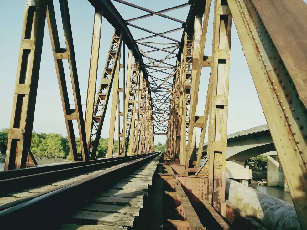 railroad-track-amidst-bridge-against-sky