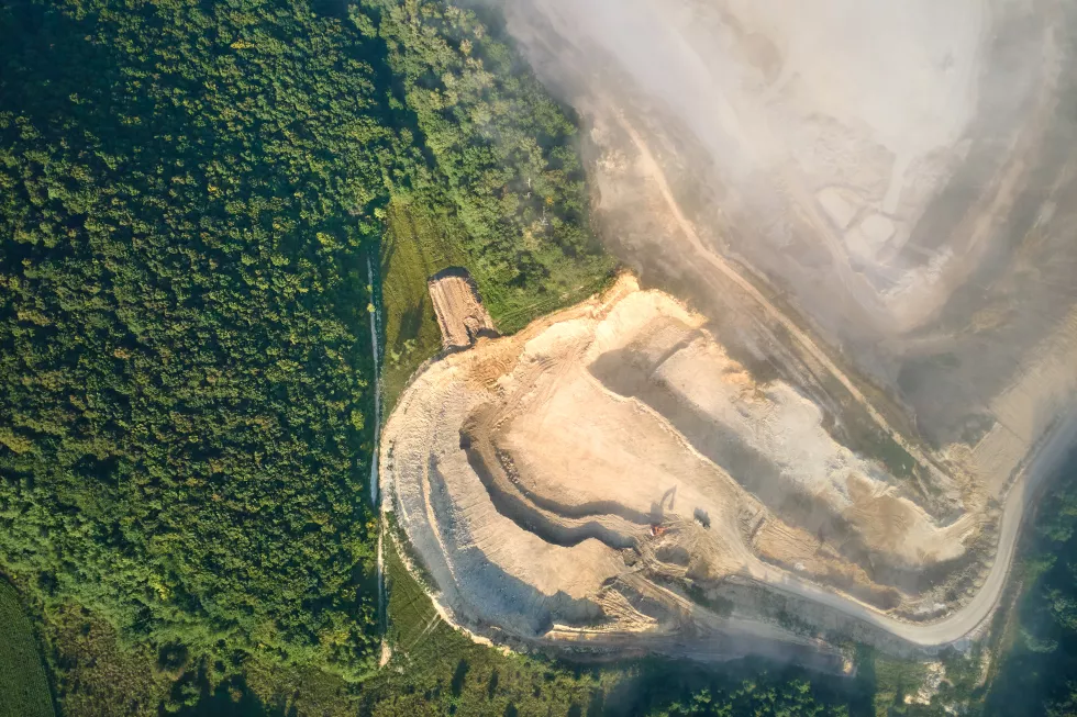 aerial-view-open-pit-mining-site-limestone-materials-extraction-construction-industry-with-excavators-dump-trucks
