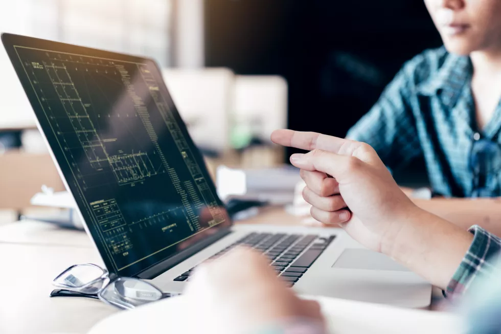 teenagers-develop-programming-with-blueprint-code-laptop-monitor