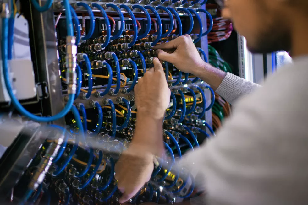 man-working-with-server-cabinet
