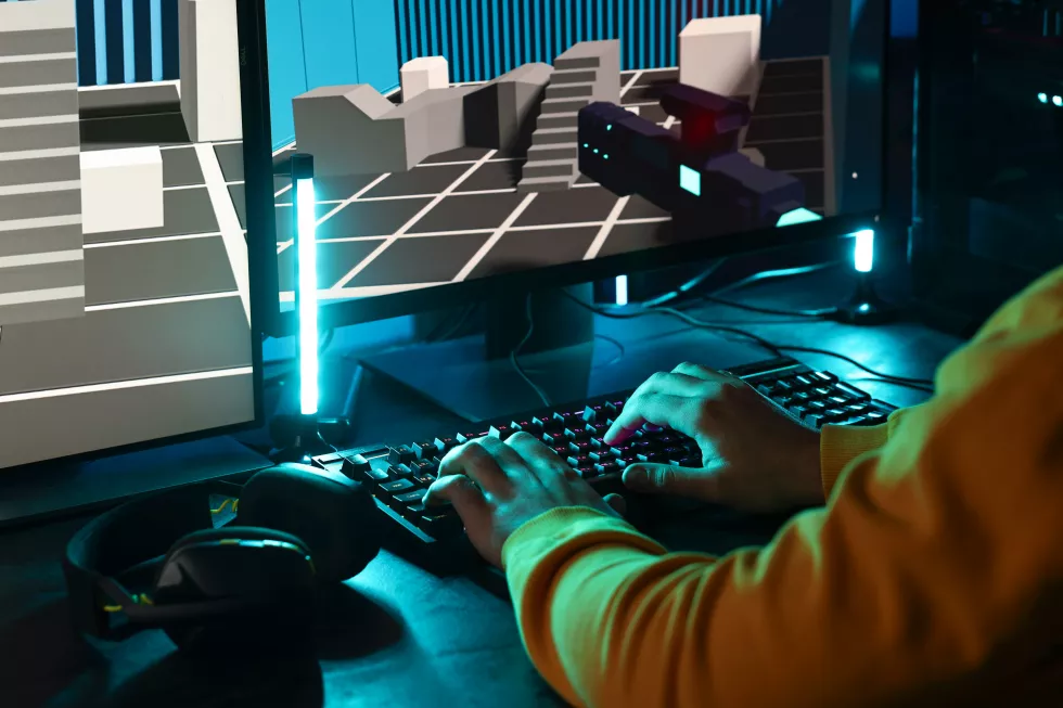 man-playing-video-games-computer-indoors-closeup
