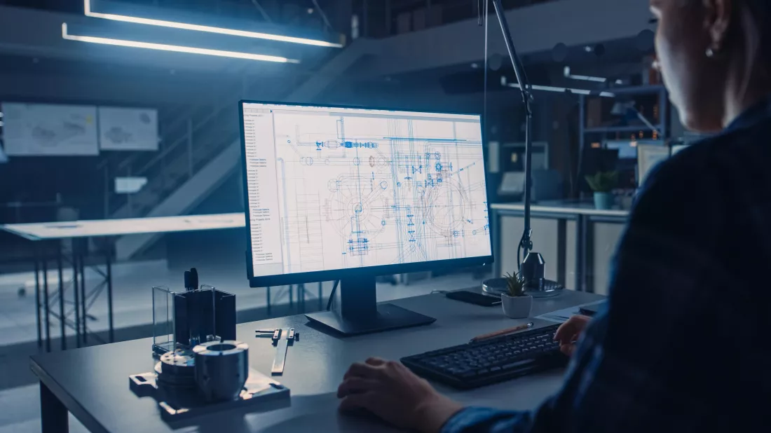 man-sits-desk-front-computer-screen-that-says-data(1)
